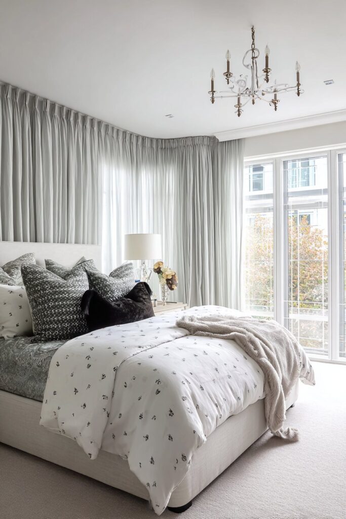 Ceiling-to-floor curtains with elegant custom window treatments in bedroom