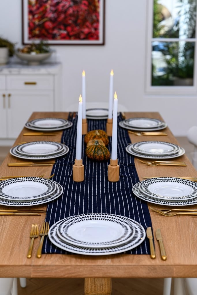 Flameless taper candles in wood holders on a family-friendly fall table