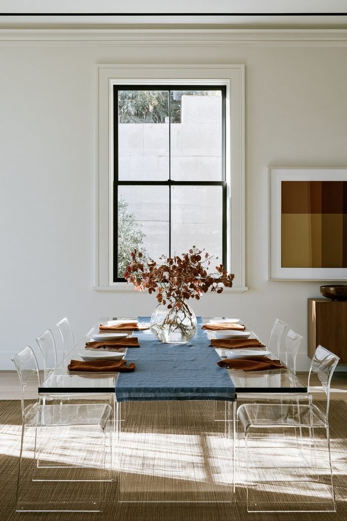 Dusty blue table runner layered with burnt orange napkins on top for contrast
