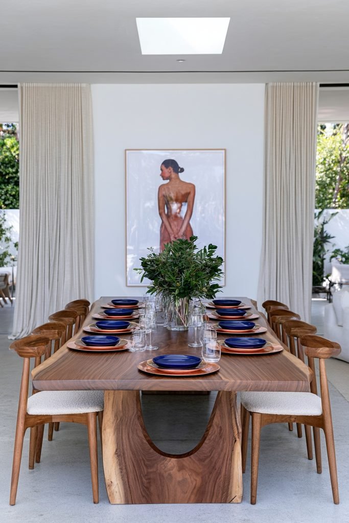 Wood and copper metal chargers alternating under blue dinnerware on a dining table