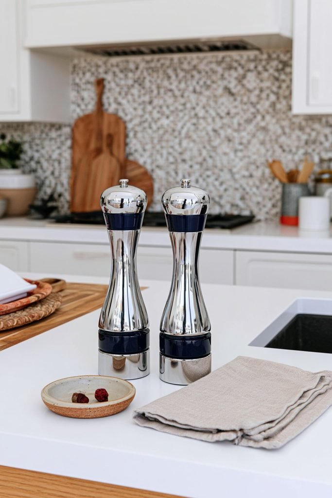 Ribbed ceramic salt and pepper mill styled on a modern kitchen counter