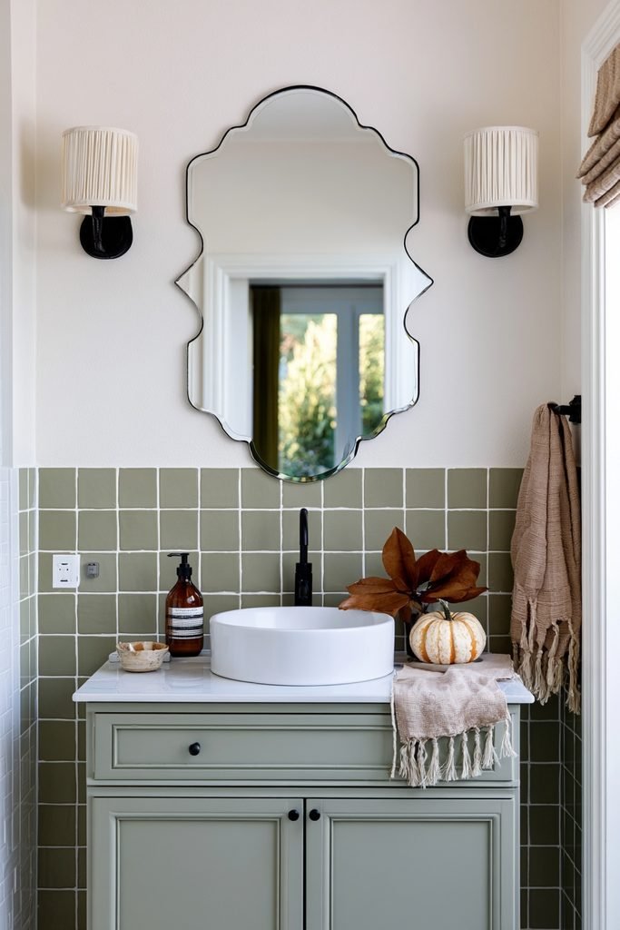 Small bathroom with amber fall-scented hand soap and warm terracotta decor