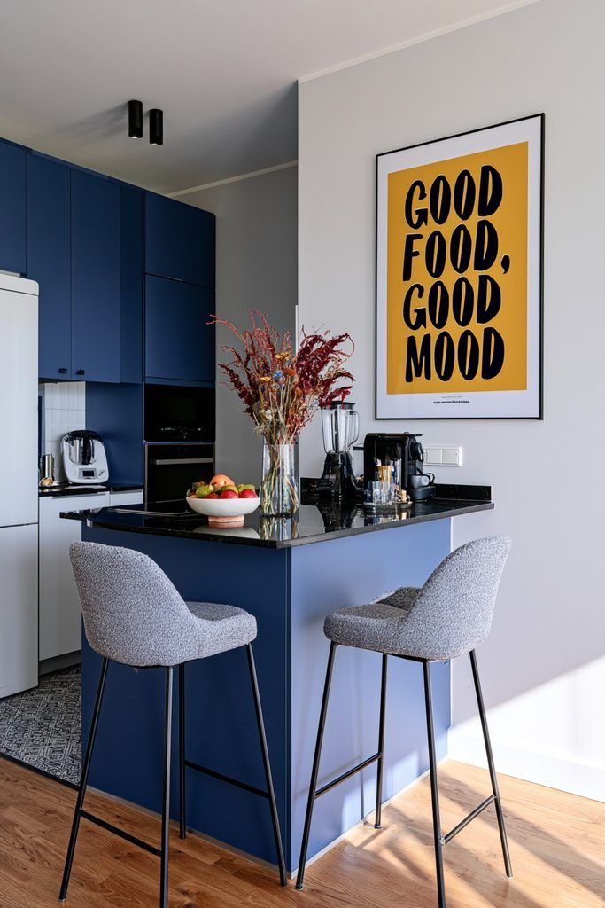 Colorful "Good Food, Good Mood" framed wall art beside a breakfast bar in a contemporary kitchen.