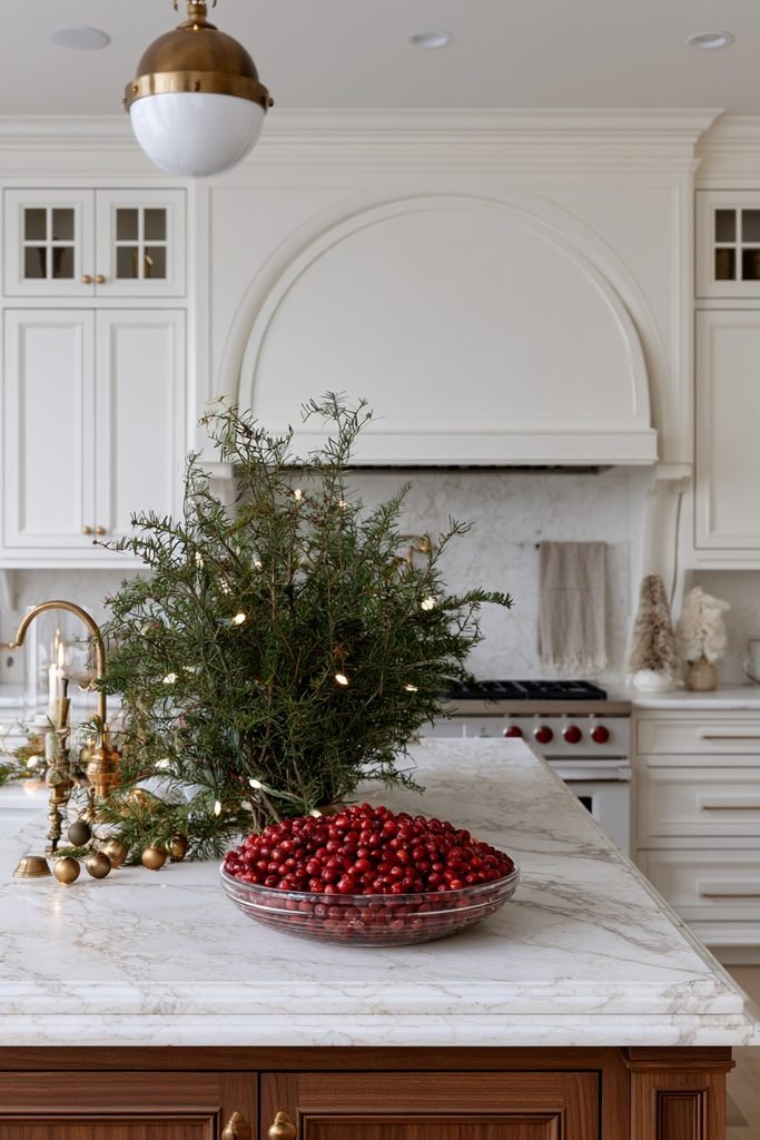Cranberry and evergreen Christmas centerpiece decorating a kitchen island
