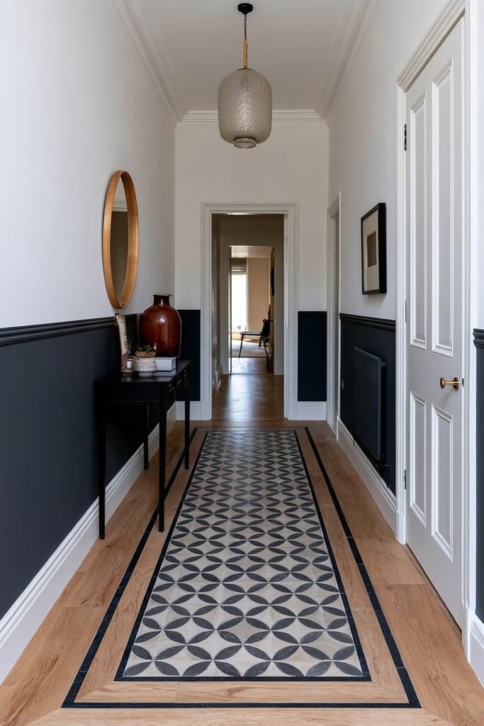 Narrow hallway with a contrasting lower wall and dado rail creating visual width and structure