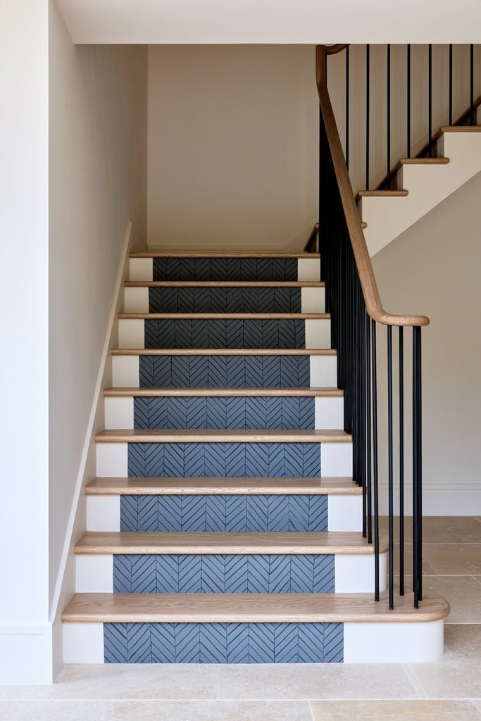 Staircase risers decorated with a painted two-tone herringbone pattern