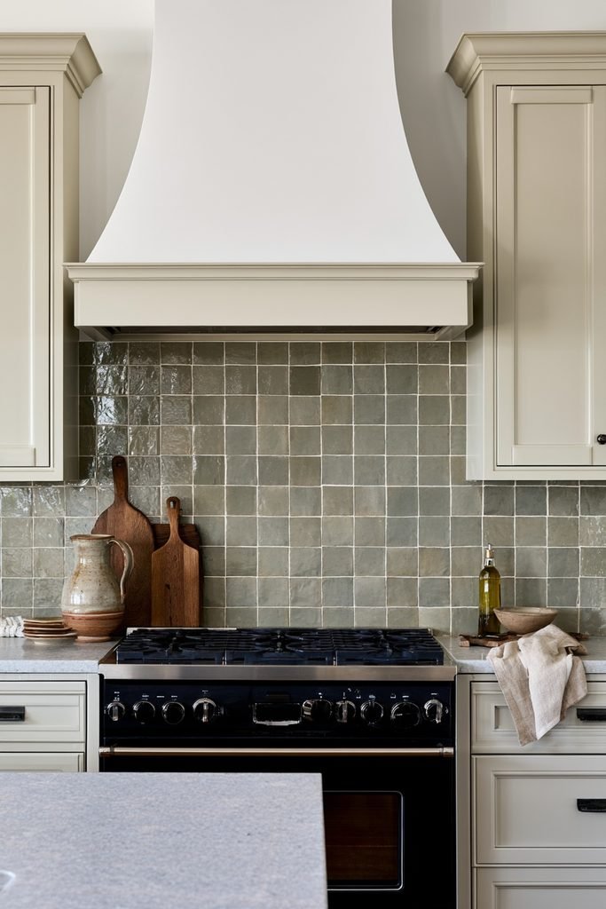 Mid-century inspired kitchen with a speckled terrazzo backsplash and warm wood cabinetry.