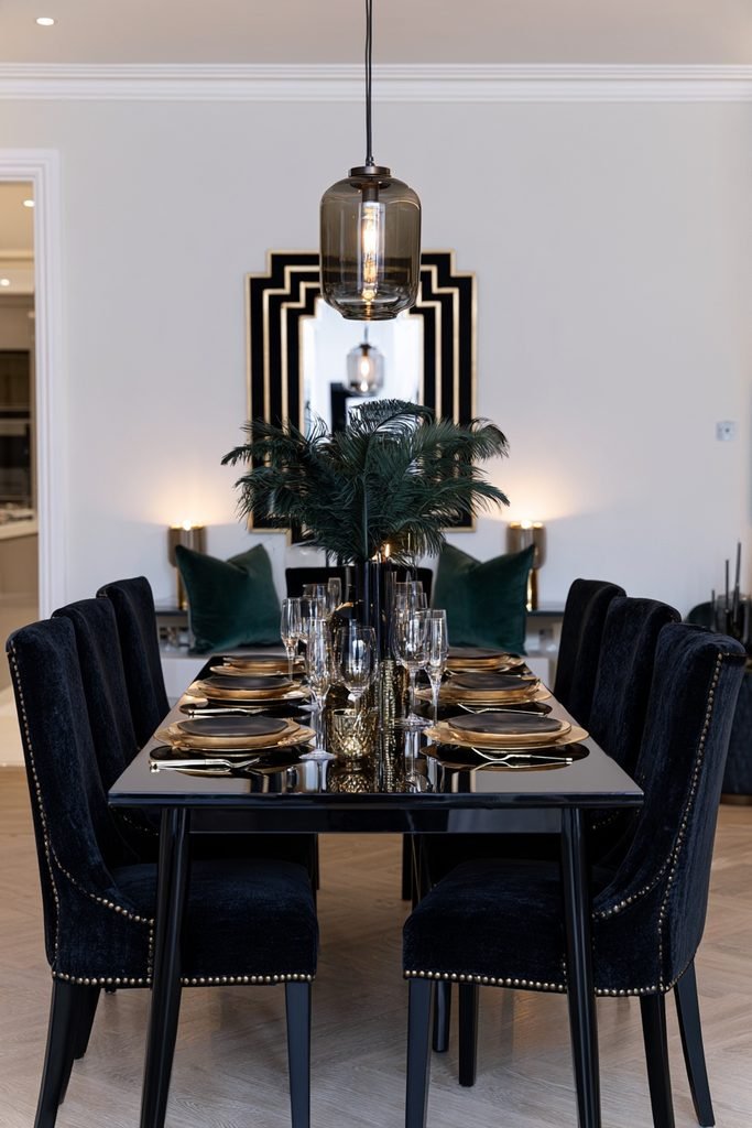 Art Deco New Year's Eve dining room decorated in black and gold with velvet and brass accents
