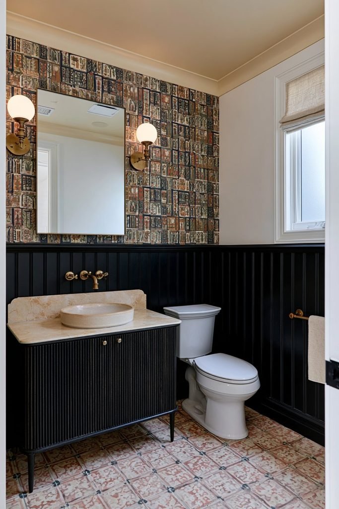 Black vertical molding wainscoting paired with colorful botanical wallpaper in an elegant eclectic powder room