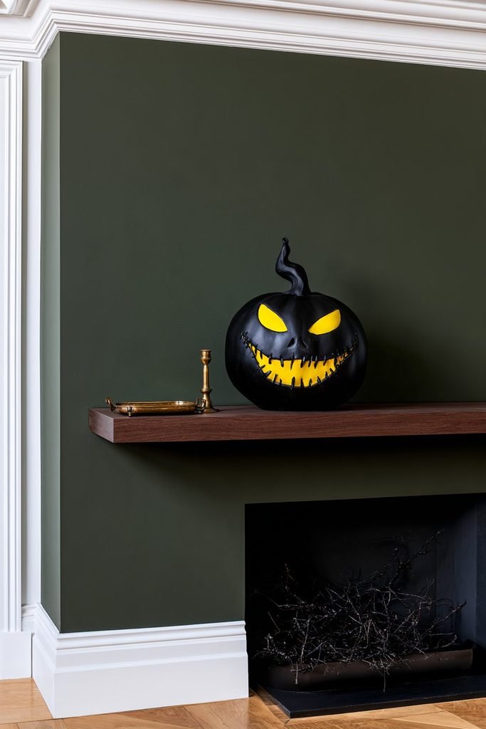 Oogie Boogie pumpkin painted with the character’s distinctive face and bold green details for a spooky Halloween decoration.