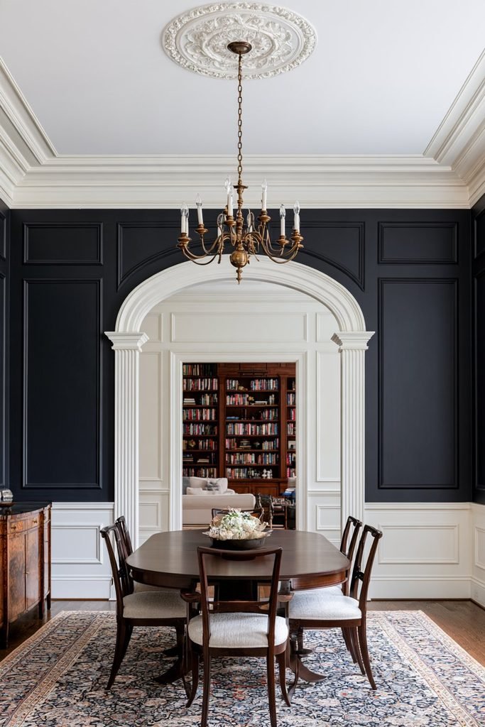 Classical arched doorway framed by decorative pilasters and picture molding in a formal dining room.