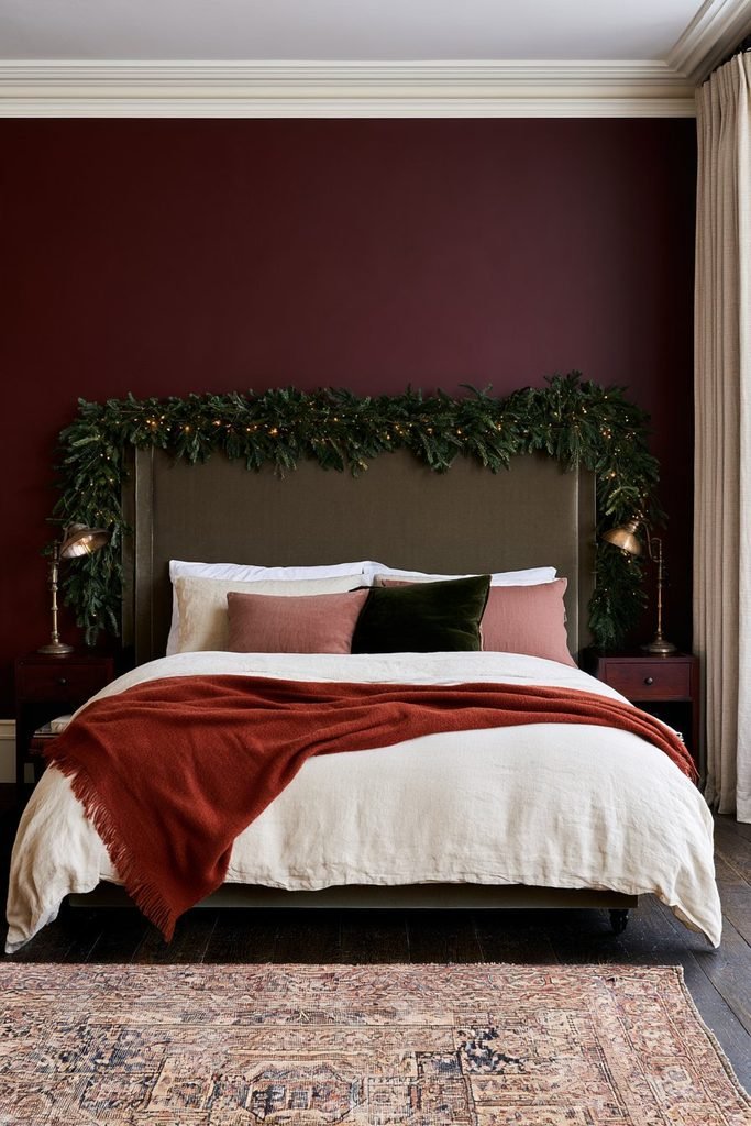 vergreen Christmas garland decorating a bedroom headboard for a cozy Christmas look
