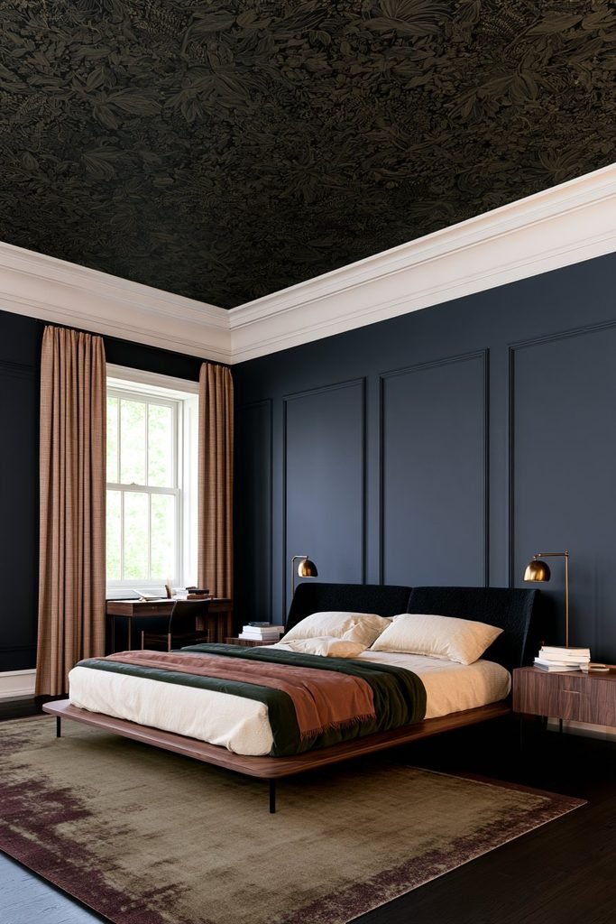 Modern dark academia bedroom with dark botanical wallpaper across a recessed ceiling, an olive upholstered bed, walnut nightstands, and concealed warm lighting.