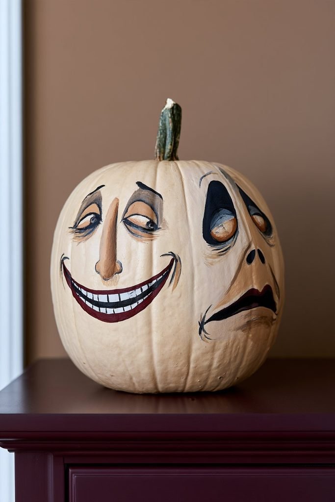Nightmare Before Christmas Mayor pumpkin featuring the character’s two-sided face design for a recognizable Halloween decoration.